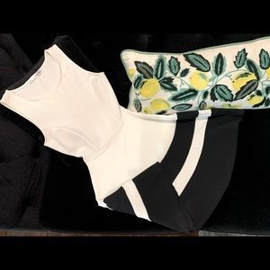 Women’s sleeveless white and black dress.